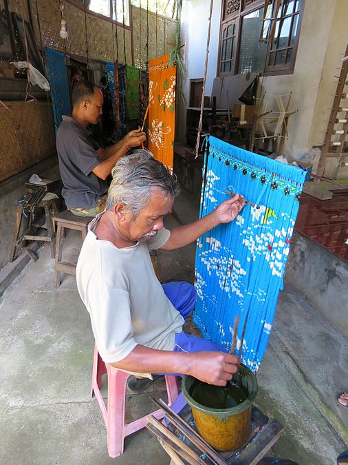 Men designing the textiles