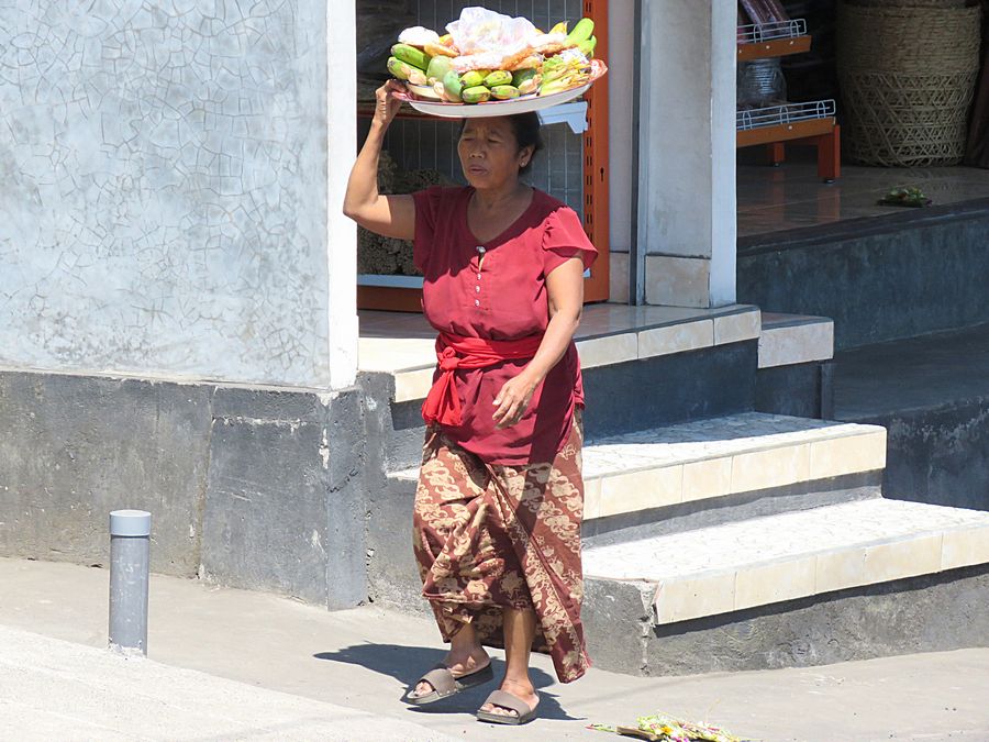 woman carrying stuff on head